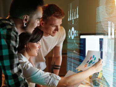 Programmers working on software at an office